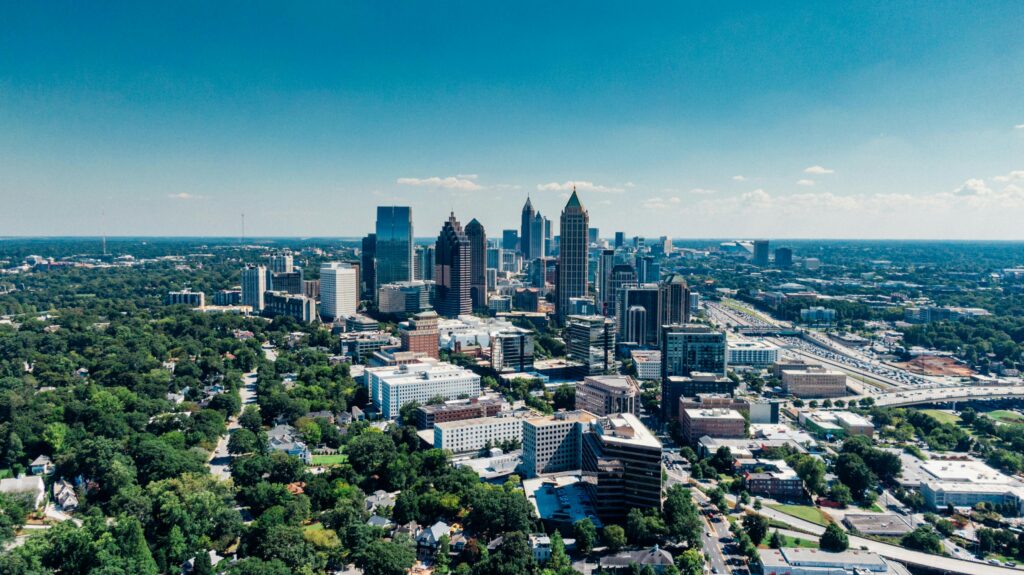 Stunning aerial photo of Atlanta's skyline featuring skyscrapers and lush greenery.